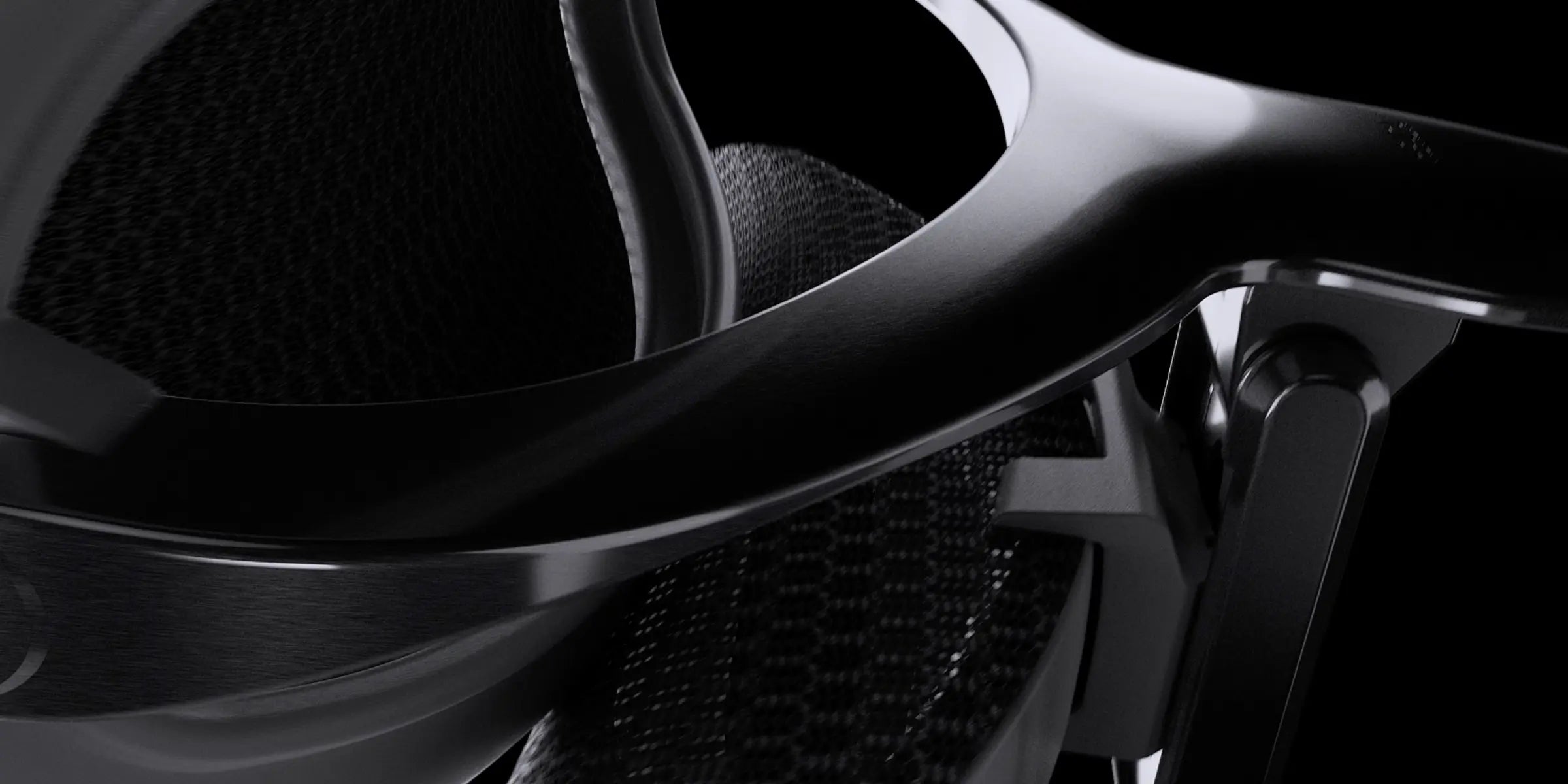 Close-up of the black backrest frame on an ergonomic office chair