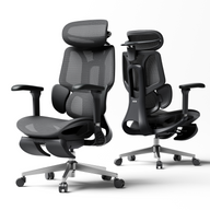 Person lounging in a modern office chair with a computer setup in the background ~scene