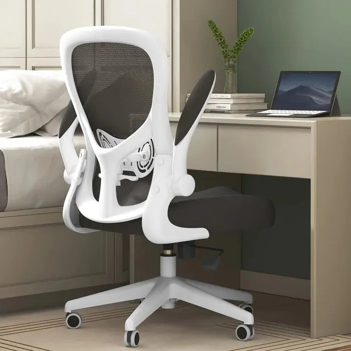 White office chair in a home office setting with a desk and laptop~2