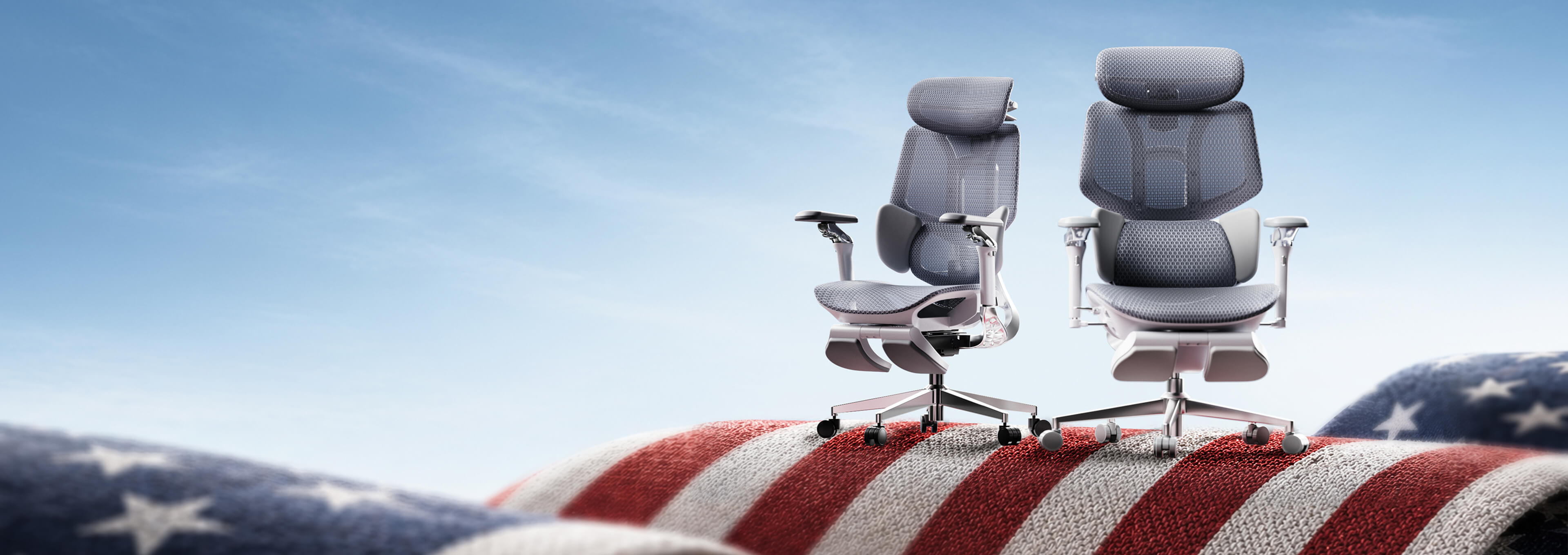 Two office chairs on an American flag with a clear blue sky background